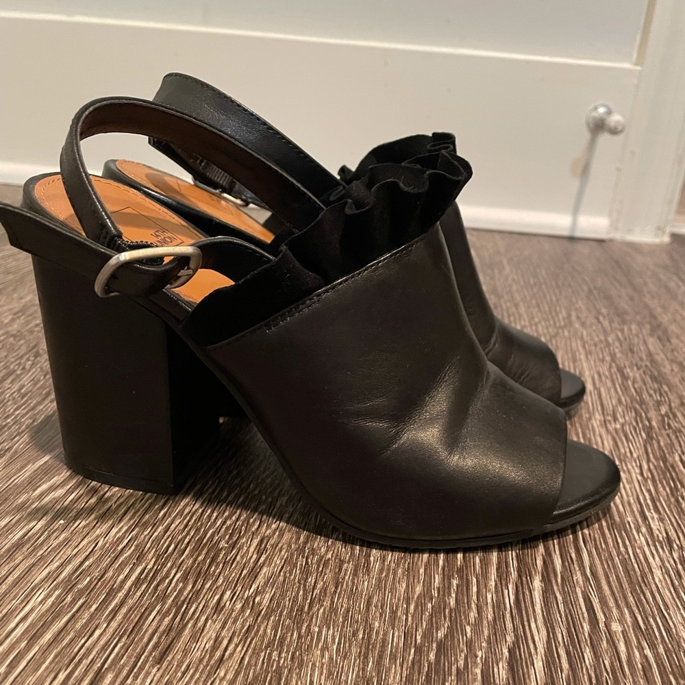 Open-toe leather heels with suede ruffled detail.